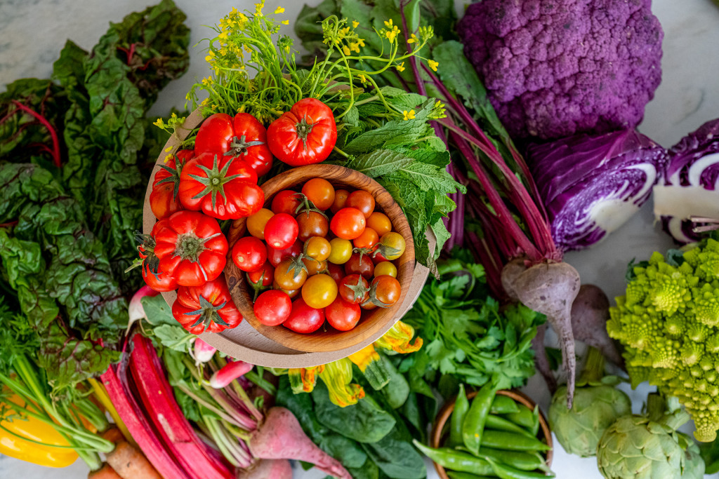 Fresh tomatoes, vegetables, and greens